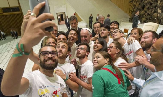 Pope's message to young people: don't let your cell phone distract you from reality.
